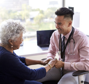 Therapists Holding Woman's Hand